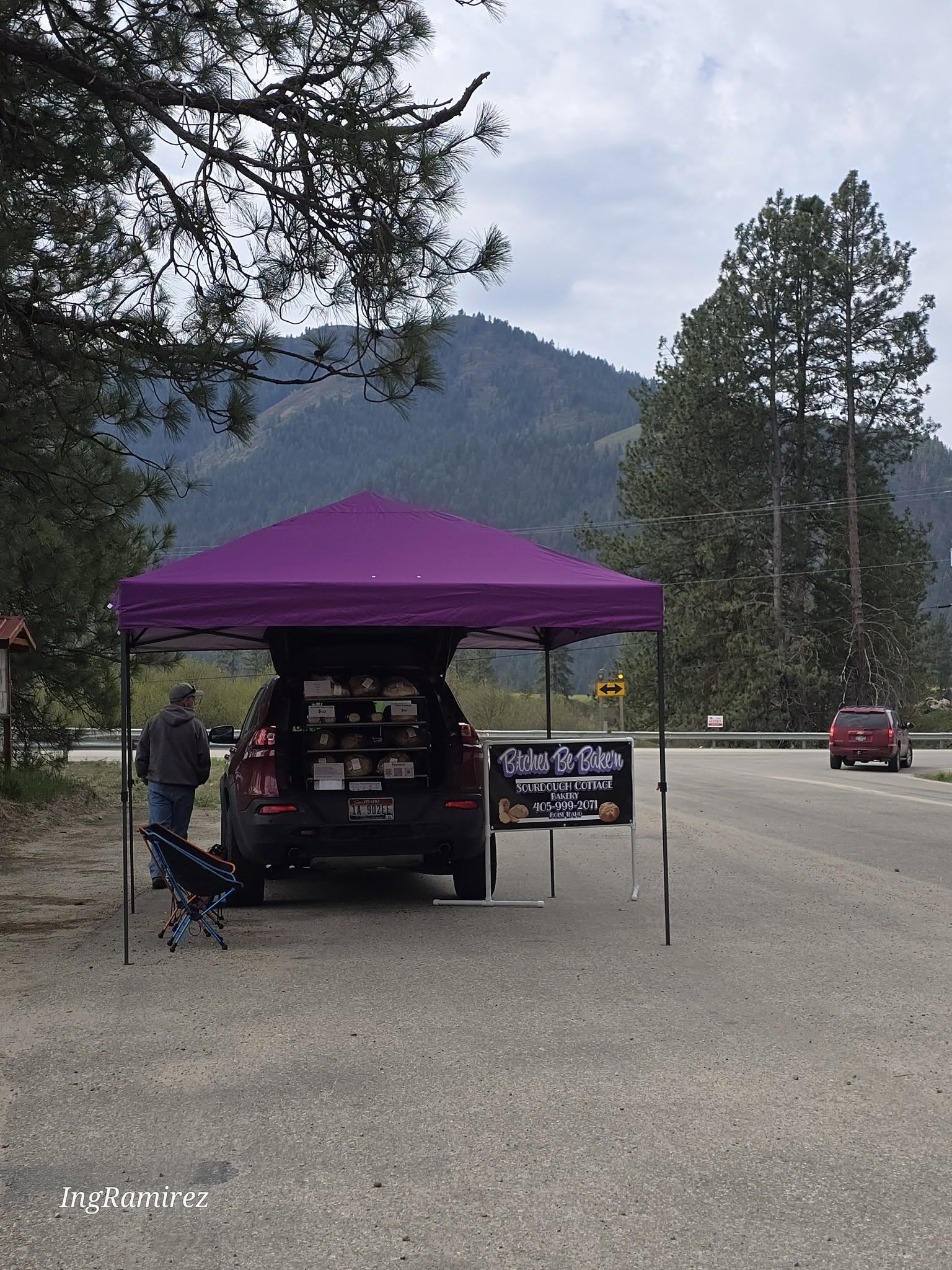 B;tches Be Bake'n roadside stand with mountain backdrop
